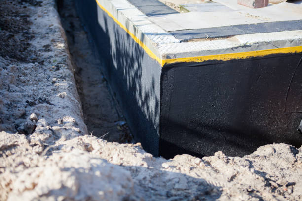 Professional Waterproofing technician working in Pell City, AL